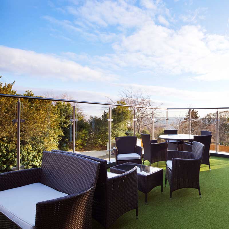 Balcony space with tables and chairs